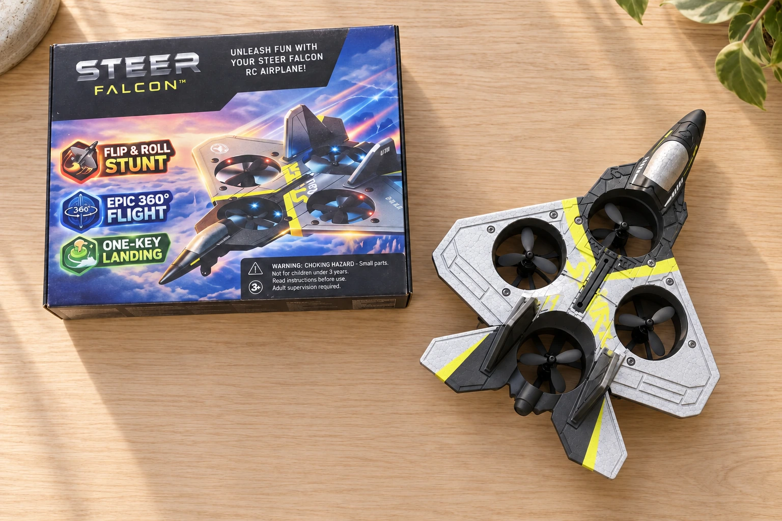 Overhead view of the gray and yellow Steer Falcon next to its branded retail box
